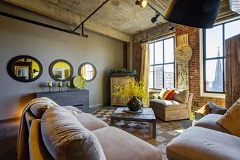 Exposed brick or polished concrete walls